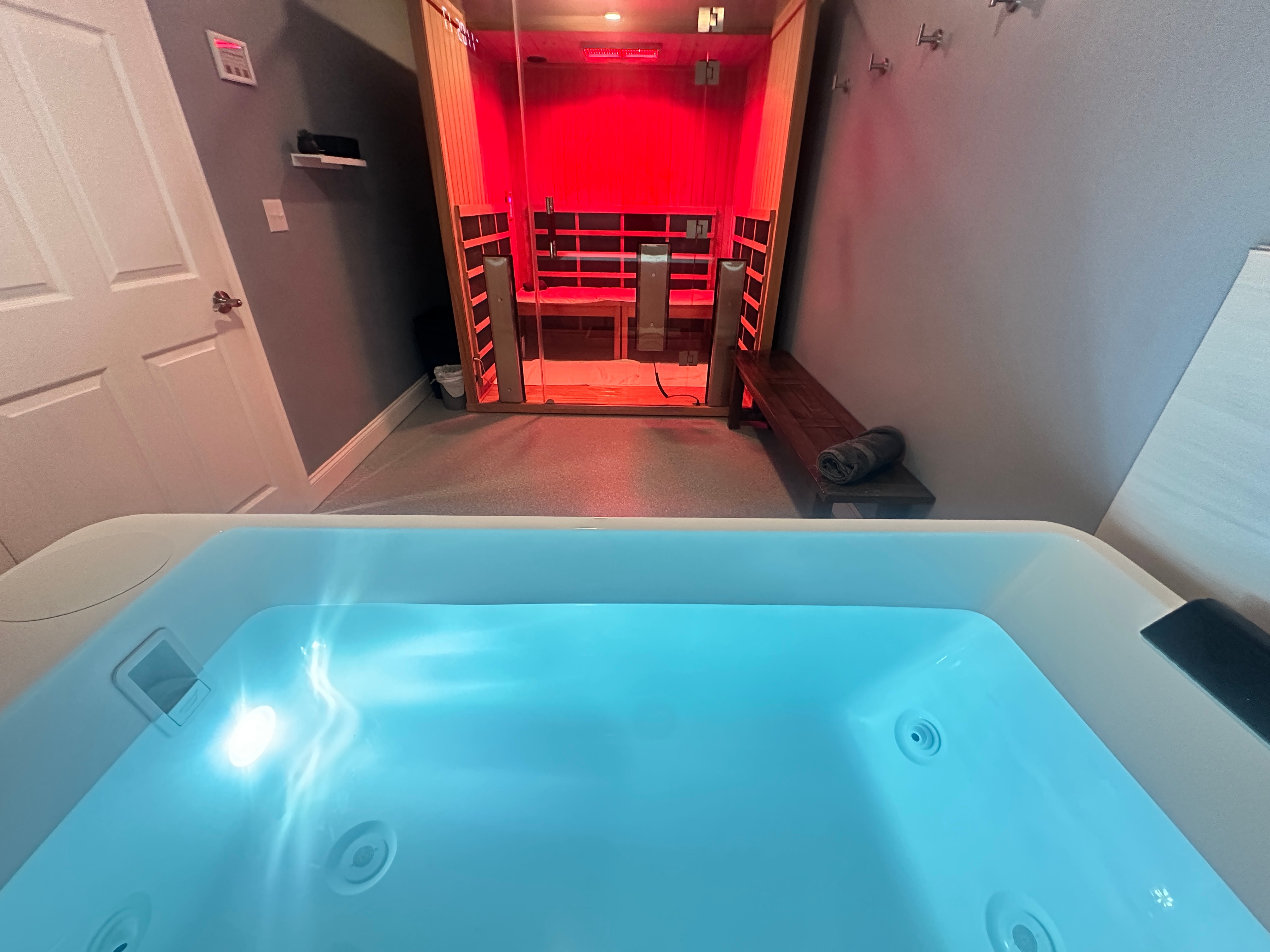 Private infrared sauna and commercial cold plunge contrast therapy suite